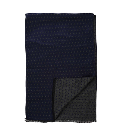 The Amanda Christensen Double Face Dot Scarf 440614 features a dark blue color, small dot pattern, double-face design, and short fringed edges.