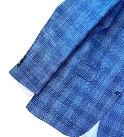 The TailoRed Gianni Sport Coat 8130534 is a blue plaid men's blazer with a front pocket and three dark sleeve buttons, shown on a white background.