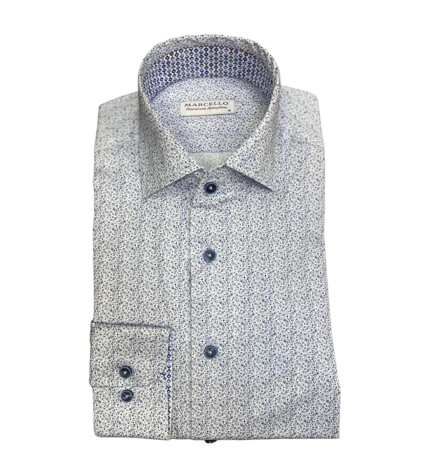 A neatly folded Marcello W-968R Indigo Mini Abst long-sleeve shirt with a small blue and white pattern, blue buttons, roll collar, and a Marcello label inside the collar, made from luxurious cotton.