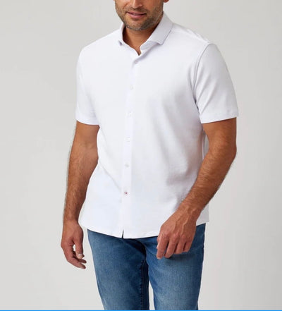 A man wearing a Stone Rose SS Pique Shirt 2K7T241 and blue jeans stands against a plain light background.