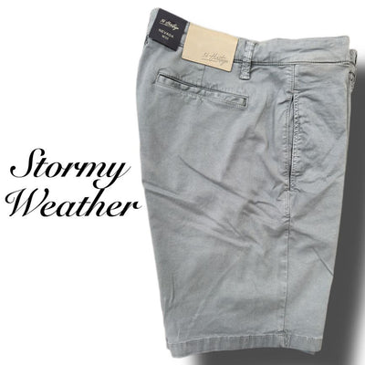 The 34 Heritage Nevada Soft Touch Shorts by 34 Heritage are slim fit, light gray shorts with a back pocket and label, made from Soft Touch fabric, shown next to the text Stormy Weather.