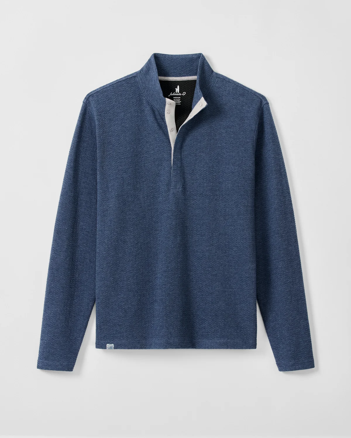 The Johnnie-O Ransel Hidden Snap Pullover Big & Tall is a long-sleeve, blue shirt featuring moisture-wicking drirelease stretch fabric, a collared neckline, and a partial button placket. It is shown laid flat against a light background.