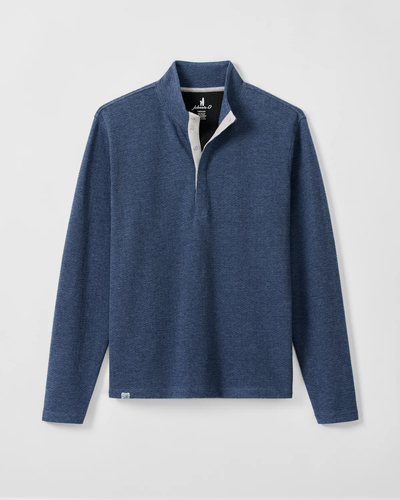 The Johnnie-O Ransel Hidden Snap Pullover Big & Tall is a long-sleeve, blue shirt featuring moisture-wicking drirelease stretch fabric, a collared neckline, and a partial button placket. It is shown laid flat against a light background.