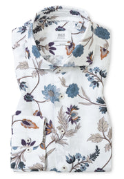 The Eterna Modern Kent Shirt Dobby 1343-XS82 is a folded, non-iron, long-sleeve dress shirt by Eterna with a white base and blue, purple, and brown floral print in a contemporary fit.