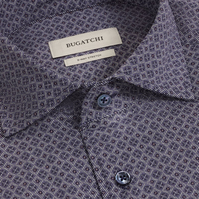 Close-up of the Bugatchi Devon Medallion Sport Shirt (KF9433K80), showcasing a small geometric print, blue buttons, and a visible 8-WAY STRETCH label. This wrinkle-resistant shirt by Bugatchi provides exceptional comfort and sophisticated style.