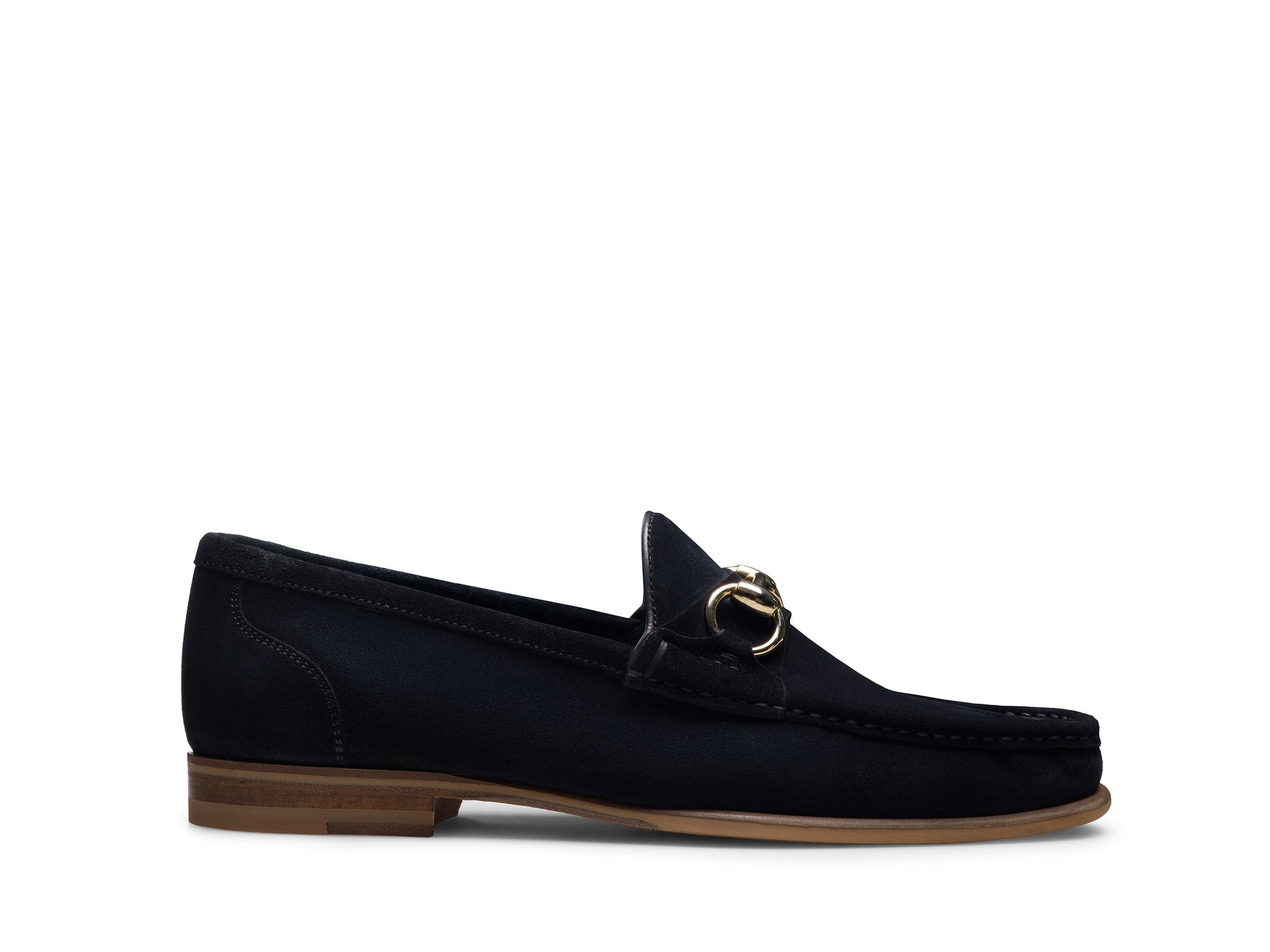 The Magnanni Giancarlo Moc Toe Bit Loafer by Magnanni is a black suede loafer with calfskin and suede hand-stitched accents, gold horsebit detail on the upper, a brown sole, and a low heel, shown in side profile against a white background.