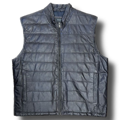 The Missani Leather Vest by Missani is a sleeveless, zip-up black vest made from Italian lambskin leather, featuring horizontal stitching and two side pockets, shown on a white background.
