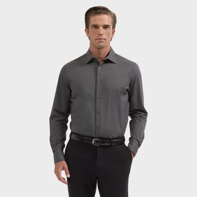 A man wearing the Bugatchi James Chevron Sport Shirt (KF9008K60) and black pants with a belt, standing against a plain white background.