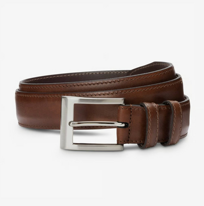 The Allen Edmonds Wide Basic Belt by Allen Edmonds, handcrafted in America from premium brown Italian calfskin leather and featuring a sleek silver rectangular buckle, is shown neatly coiled against a plain white background.