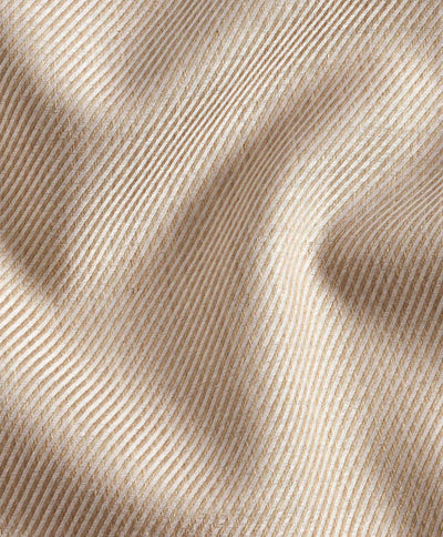 Close-up of beige corduroy fabric with diagonal ridges and soft folds, showcasing the texture and pattern detail of the David Donahue Cashmere Blend Shirt CBSM11101.