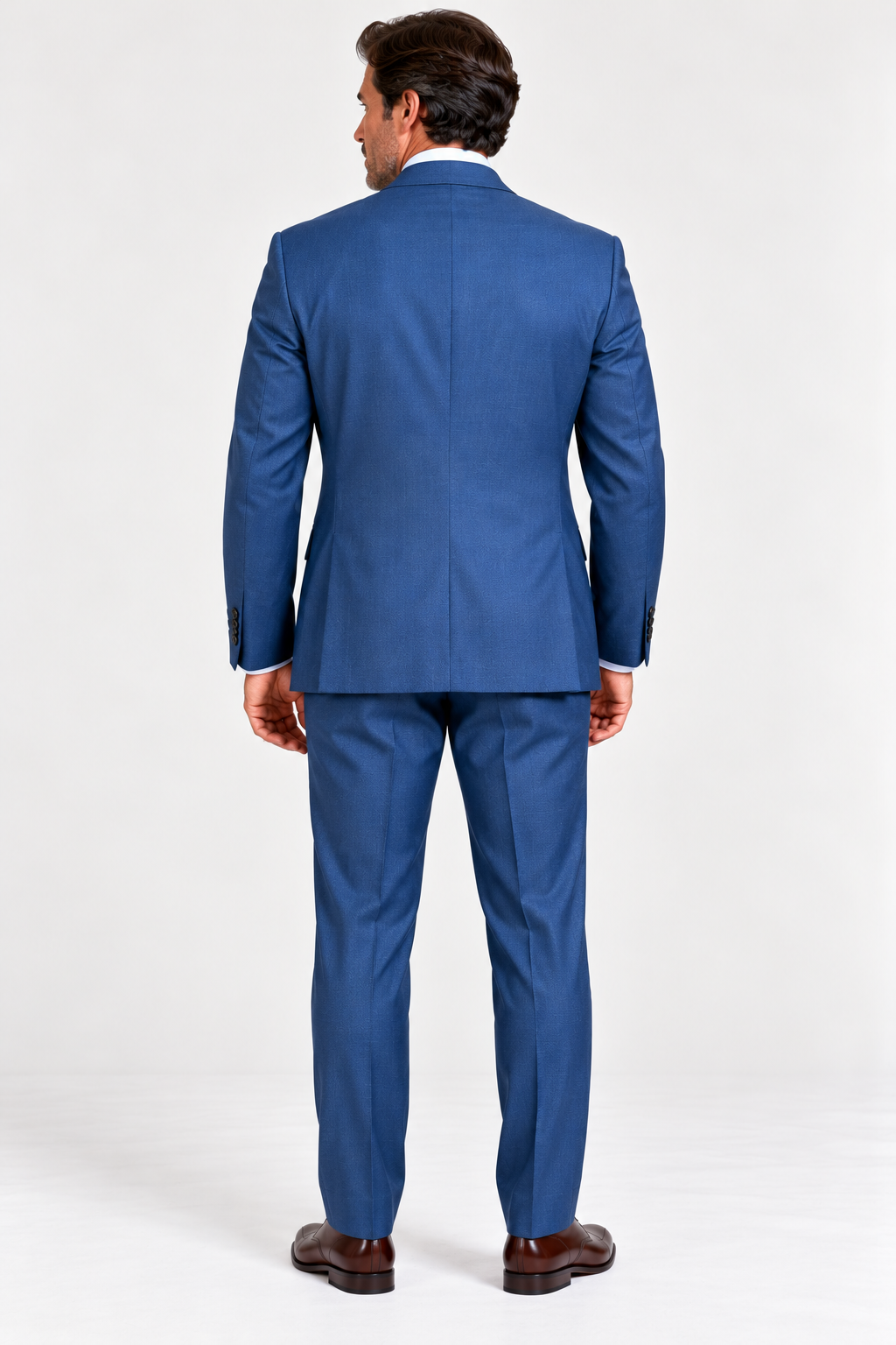 A man seen from behind wearing a Jack Victor Napoli Suit - Lagoon 3262019, white collared shirt, and brown dress shoes.