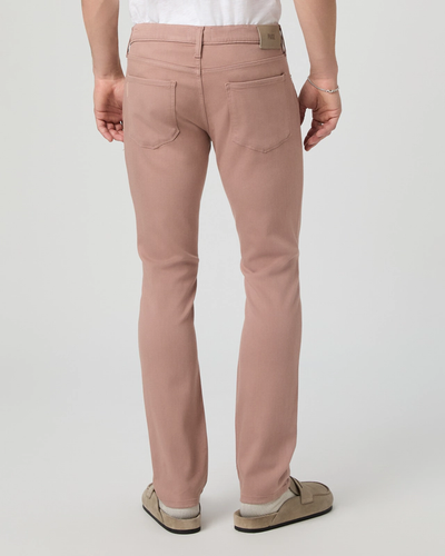 Person wearing Paige Federal Slim Straight Jeans in light pink by Paige, paired with a white t-shirt and beige shoes, shown from the back against a plain background—an effortless look with modern men’s jeans.