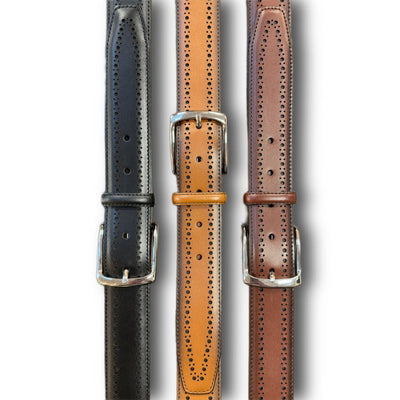 Three Allen Edmonds Manistee Belts in black, tan, and brown leather with silver buckles and brogue detailing are displayed vertically side by side.