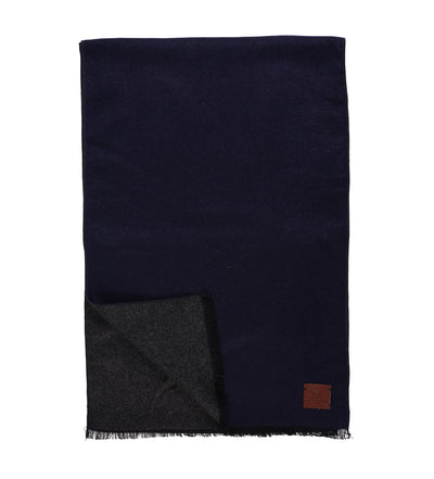 The Amanda Christensen Double Face Scarf 440714 is a rectangular dark navy scarf with a brown corner patch, a dark gray underside, and elegant fringed edges along the border from brand Amanda Christensen.