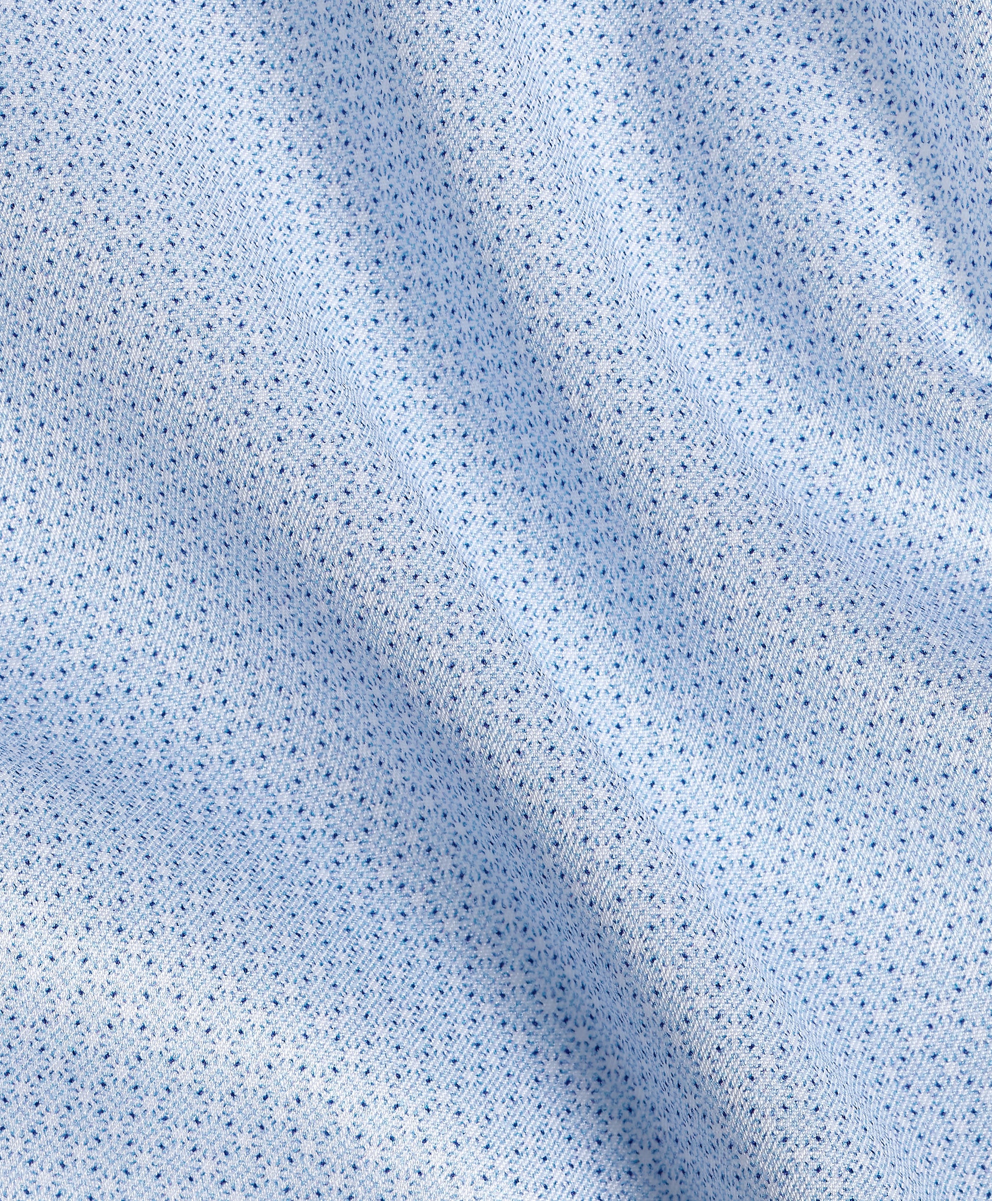 Close-up of light blue fabric from the David Donahue Micro Geometric Print Dress Shirt TBSP13203, featuring a small, repeating geometric pattern and slight folds that create soft shadows across the material.