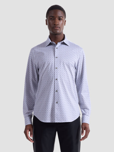 A man stands facing forward against a plain light gray background, wearing the Bugatchi James Floral Check Sport Shirt HF9051K60 and black pants.