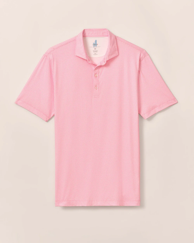 The Johnnie-O Performance Polo - Wesson is a short-sleeved, light pink and white patterned polo with a collar and three buttons from Johnnie-O, shown on a beige background.