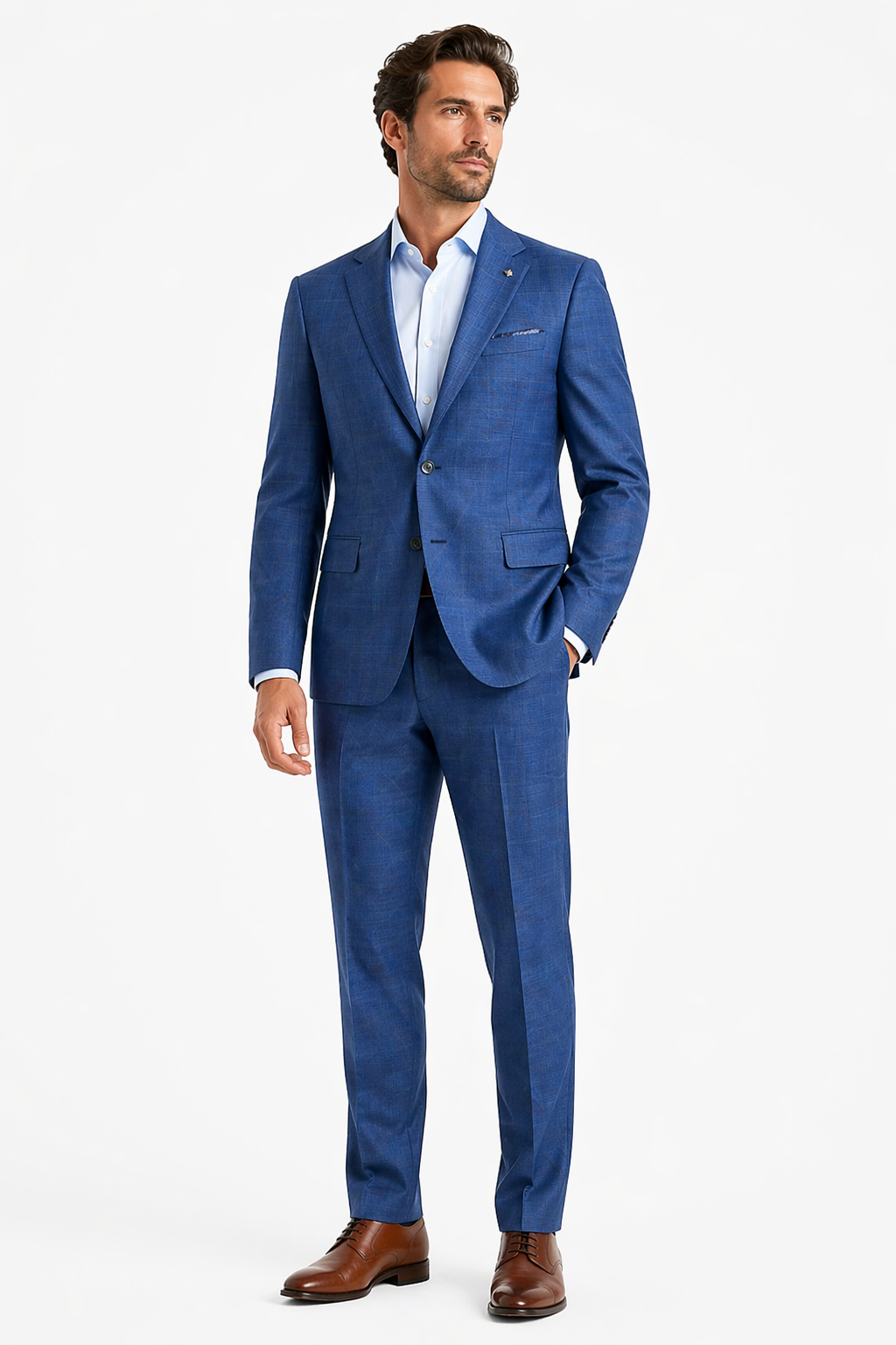 A man wearing the Jack Victor Napoli Suit 3251467, crafted from fine Italian wool, paired with a white dress shirt and brown dress shoes, stands against a plain white background.