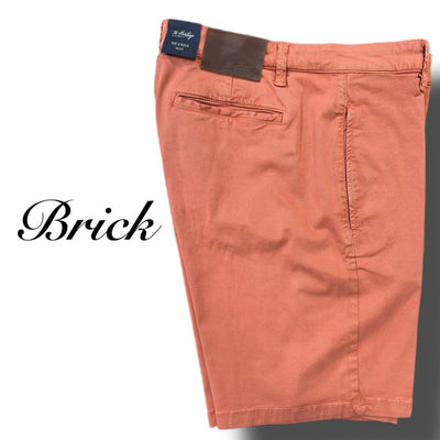 The 34 Heritage Nevada Soft Touch Shorts by 34 Heritage are brick-colored, slim fit with back and side pockets, crafted from Soft Touch fabric for comfort. Pictured on a white background with "Brick" beside them.