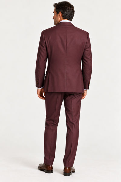 Back view of a man wearing a MaxDavoli Burgundy Wool Suit MD2800, white dress shirt, and brown dress shoes.