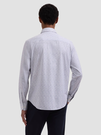 A person shown from the back against a plain background, wearing the Bugatchi OP James OoohCotton® Leaf Print Shirt JF9212K60 with a light-colored pattern and dark pants.