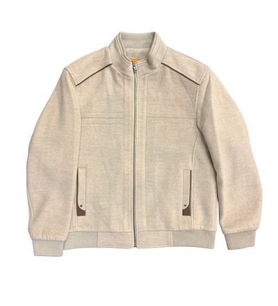 Enzo Evan Moto Jacket by Enzo in beige, featuring a zip-up front, ribbed cuffs and hem, two front pockets, and a stand-up collar, laid flat on a white background.