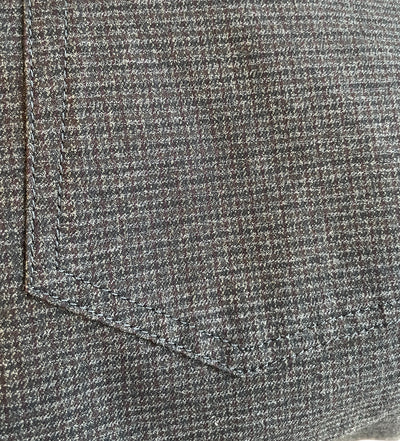 Close-up of a gray pocket with a subtle checkered pattern and visible stitching, highlighting the wrinkle-resistant quality of Alberto Stone Mini Check Smart Wool Pants 1625 by Alberto.