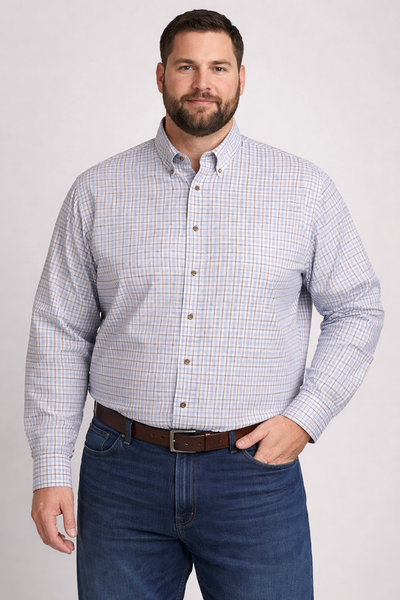 A man wearing the F/X Fusion Big & Tall Men's Check Sport Shirt by F/X Fusion, paired with blue jeans and a brown belt, stands against a plain light background.