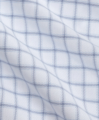 The David Donahue Windowpane Check Dress Shirt TBSP13810 features crisp white Pima cotton fabric with a classic navy blue windowpane grid. Subtle folds and fine texture highlight its exceptional craftsmanship, offering both comfort and polish characteristic of the David Donahue brand.