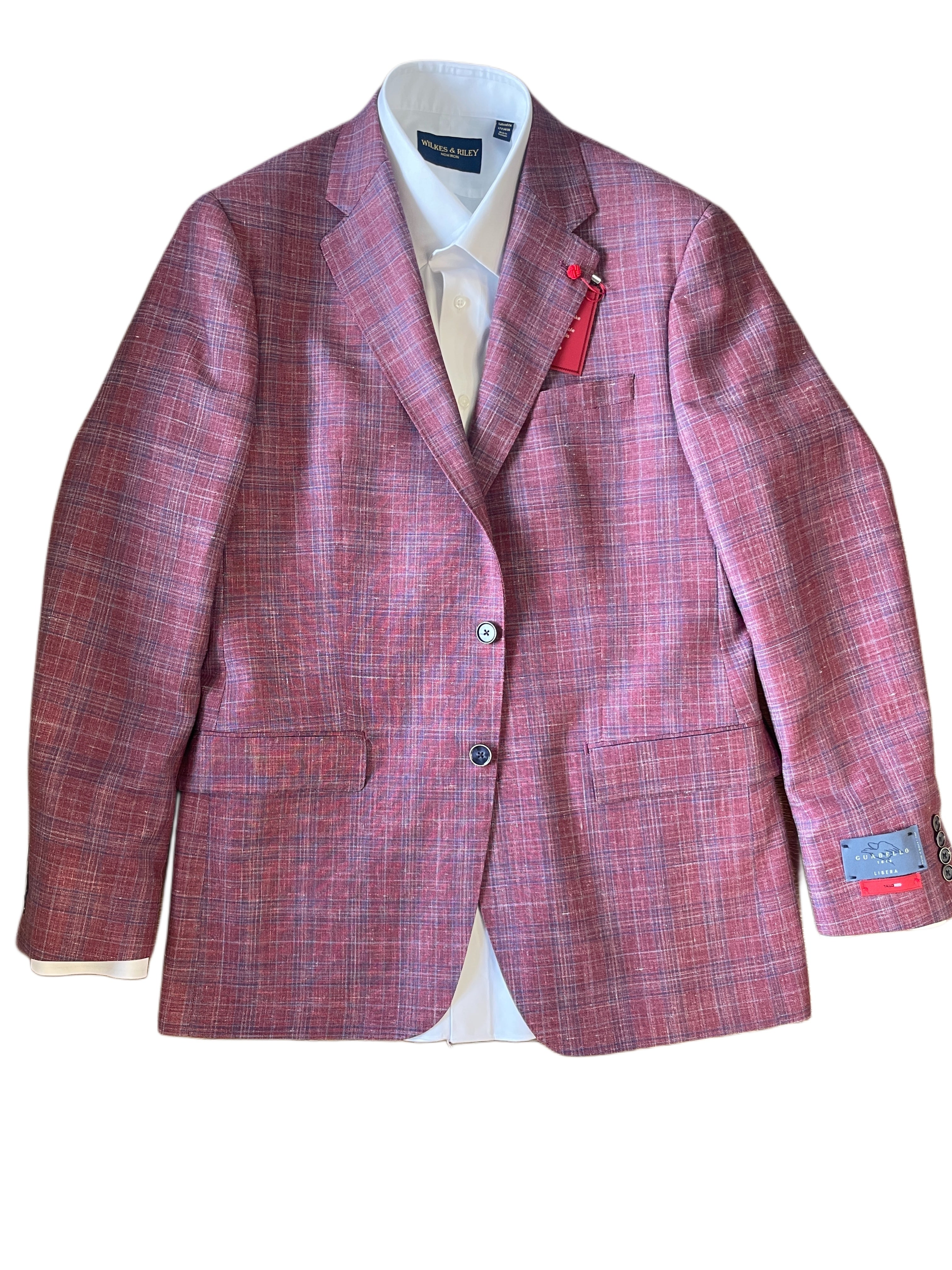 The TailoRed Gilmore Sport Coat 8130538 is a berry plaid jacket with buttons, flap pockets, a visible sleeve tag, and is worn over a white dress shirt.