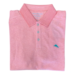 A folded pink Tommy Bahama Emfielder Polo Big & Tall shirt made from Supima cotton, featuring a collar, three buttons, and a small blue dolphin logo on the left chest.