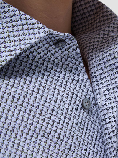 Close-up of the Bugatchi LS Devon GF9025K80 Platinum by Bugatchi: a button-up shirt in premium fabric with a black and white geometric pattern, showcasing part of the collar and two grey buttons—evoking refined Italian menswear.