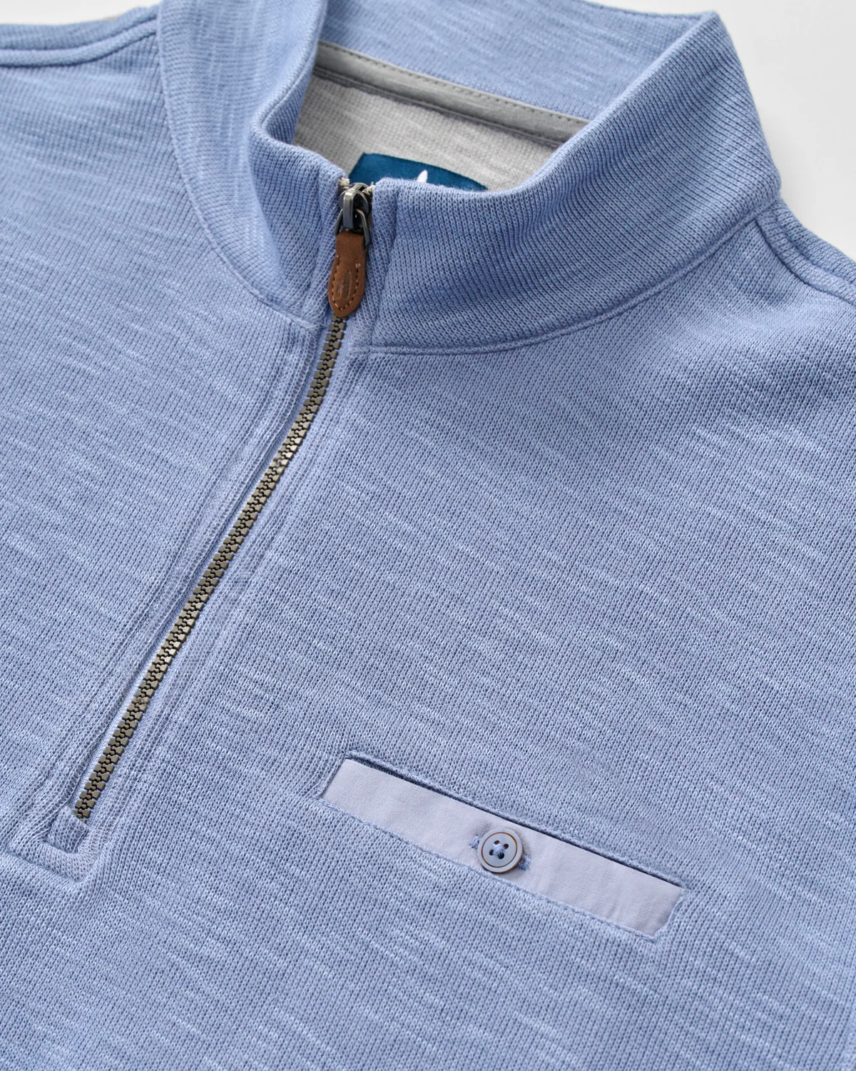 Johnnie-O Flame Stitch 1/4 Zip Sweater Big & Tall in light blue, featuring a ribbed collar, metal zipper, moisture-wicking fabric, and a single buttoned chest pocket.