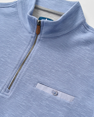 Johnnie-O Flame Stitch 1/4 Zip Sweater Big & Tall in light blue, featuring a ribbed collar, metal zipper, moisture-wicking fabric, and a single buttoned chest pocket.