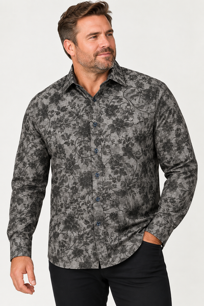 Man wearing the 7 Downie St. Floral Long Sleeve Sport Shirt Big & Tall, standing with one hand in his pocket and looking slightly to the side.