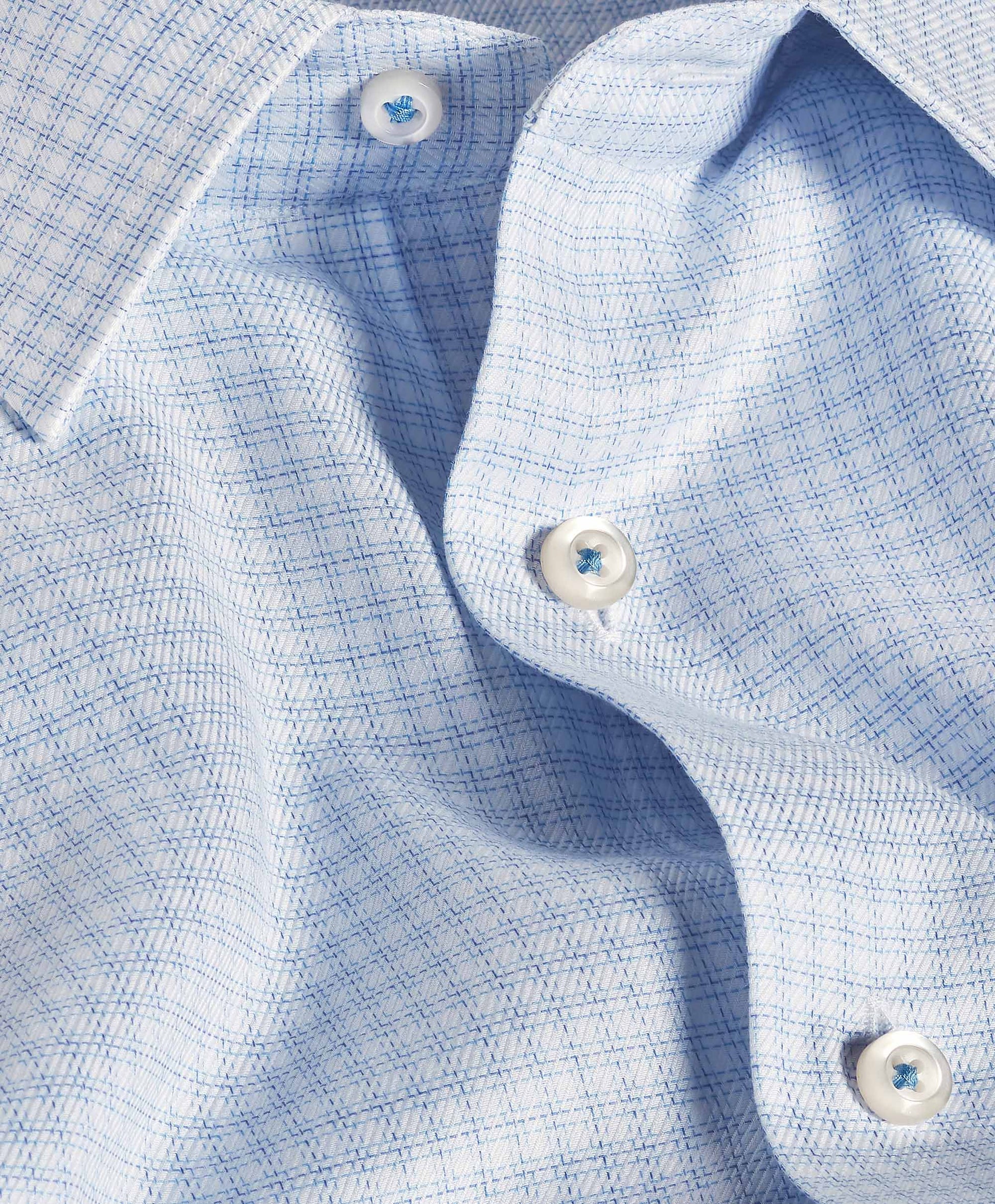 Close-up of the David Donahue OP White & Blue Check Dress Shirt (TBSP12816135), featuring a trim fit collar, buttons, and textured fabric in a subtle check pattern for a refined look.