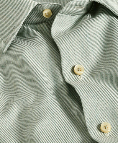 Close-up of the David Donahue Cashmere Blend Shirt CBSM11101, showcasing light green stripes, beige buttons, textured fabric, and part of the collar.