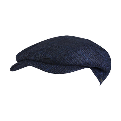 The Wigens Ivy Contemporary Cap 102335 is a navy blue Melton wool Ivy cap featuring a textured pattern, presented from a side angle against a white background.