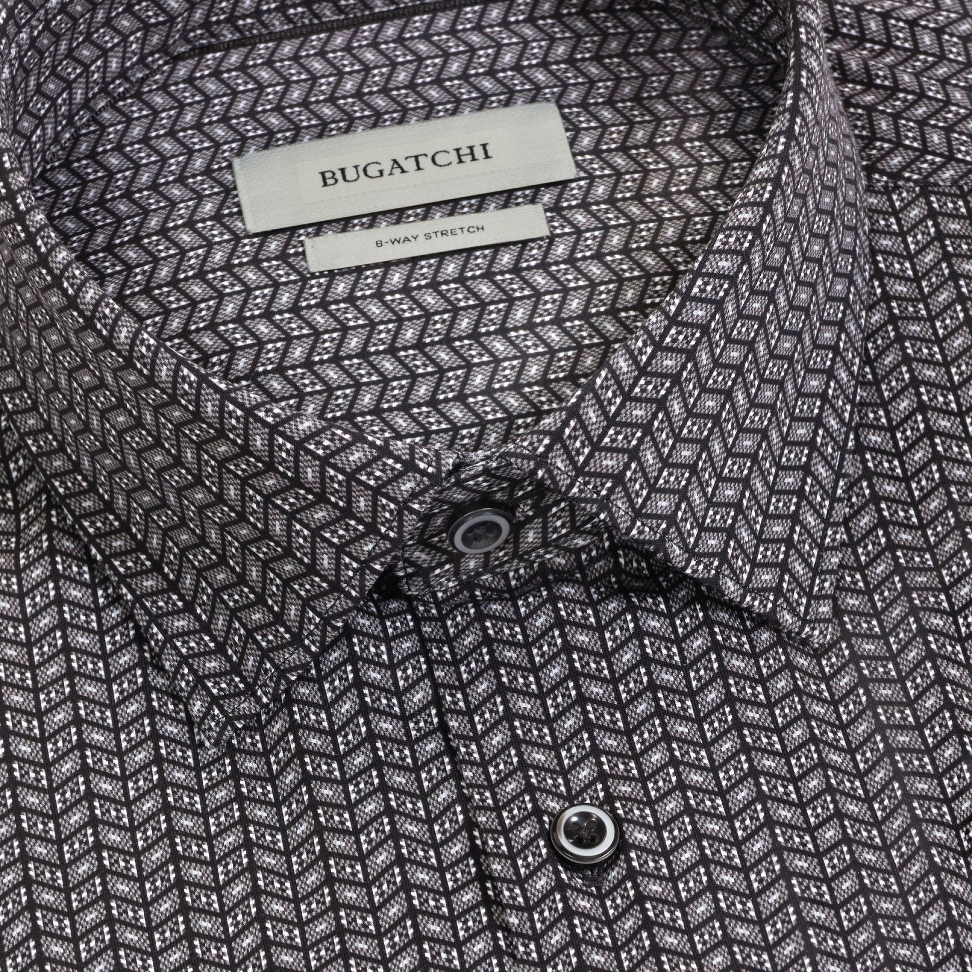 Close-up of the Bugatchi James Chevron Sport Shirt for men, featuring a geometric black and white chevron pattern with 8-way stretch. This wrinkle-resistant shirt showcases a pointed collar and visible buttons.