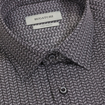 Close-up of the Bugatchi James Chevron Sport Shirt for men, featuring a geometric black and white chevron pattern with 8-way stretch. This wrinkle-resistant shirt showcases a pointed collar and visible buttons.