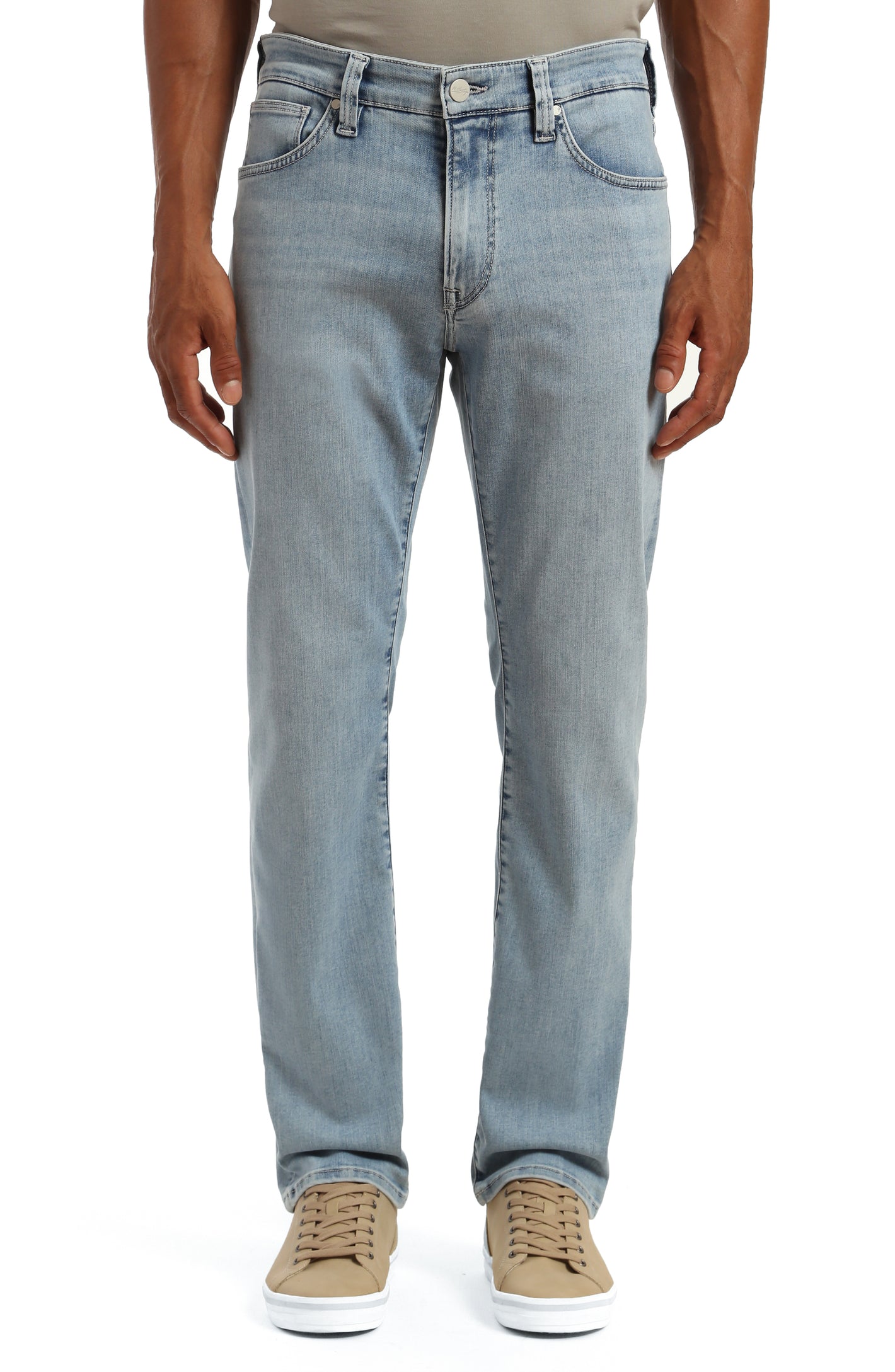 A person wearing 34 Heritage Charisma Bleached Urban Big & Tall jeans and beige sneakers stands against a white background.