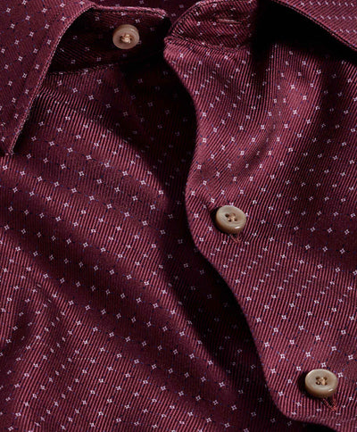 Close-up of the David Donahue Micro Dot Sport Shirt CBSM11016 in maroon with a small white dotted pattern, beige buttons, and soft Pima cotton in a modern trim fit.