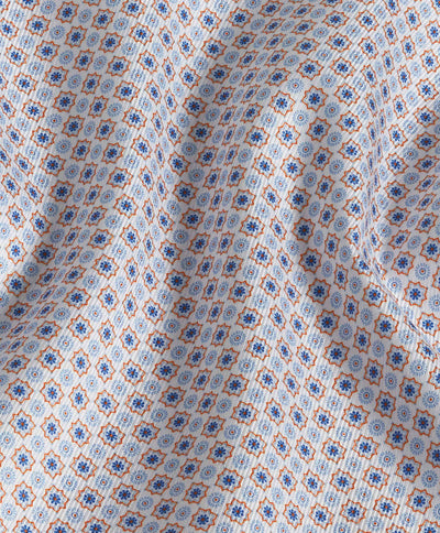 A close-up of the David Donahue Geometric Print Sport Shirt (CHBD10605), crafted from US Pima cotton and showcasing a blue, orange, and white repeating geometric pattern.