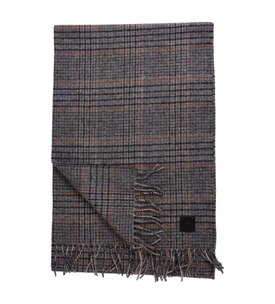 The Amanda Christensen Check Pattern Scarf 440700 features a gray check design, fringed ends, and a subtle black label—an elegant wool accessory from Amanda Christensen, shown folded on a white background.