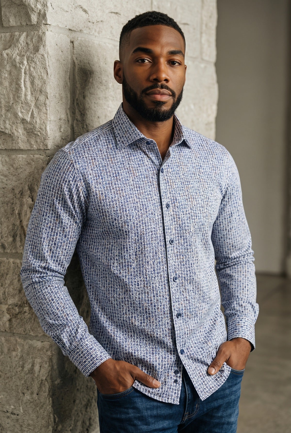 A man wearing a Marcello Dali Vertical Ovals Sport Shirt W228 with a blue and white vertical oval pattern and blue jeans.