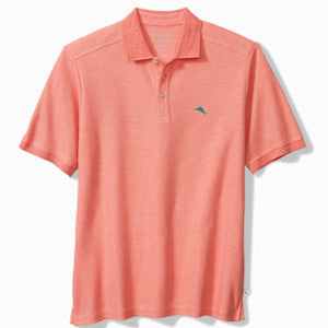 The Tommy Bahama Emfielder Polo Big & Tall by Tommy Bahama features short sleeves, a classic collar, a button placket, and a subtle embroidered logo on the chest. Crafted from moisture-wicking fabric for all-day comfort, this polo is shown in coral against a white background.