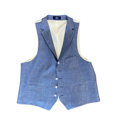 The Hart Schaffner Marx Vest N4O000 by Hart Schaffner Marx features a light blue tweed fabric, tailored fit, four buttons, three front pockets, and a cream inner lining, shown against a white background.