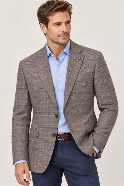 A man wearing a Jack Victor Conway Brown Plaid Sport Coat 1262312 over a light blue button-down shirt and navy trousers.
