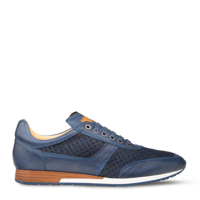 The Mezlan Maxim Dress Sneaker by Mezlan features blue embossed suede side panels, a white sole, tan heel detail, and blue laces. Handmade in Spain, this low-top sneaker is showcased on a white background.