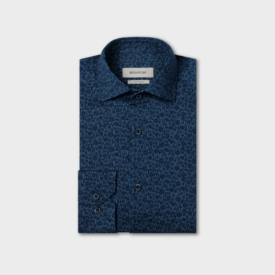 A folded long-sleeve, button-up blue Bugatchi James Floral Sport Shirt (KF9190K80) with a subtle geometric print, crafted from wrinkle-resistant performance fabric, is displayed against a plain light background.